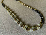 top view of gemstone bead necklace comprising grey labradorite, dark bronze and golden pyrite