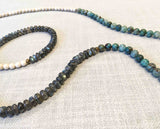 closeup of gemstone bead necklace comprising fossil jasper, green labradorite and green apatite Edit alt text