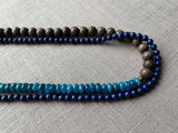 side view of gemstone bead necklace comprising blue apatite, dark blue lapis and exotic wood
