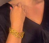 additional view of model wearing organic-shaped gold bracelet