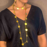 model wearing organic-shaped gold necklace
