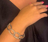 model wearing organic-shaped silver bracelet