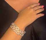 model wearing organic-shaped silver bracelet