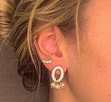 model wearing organic-shaped silver earrings