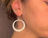 model wearing organic-shaped silver earrings