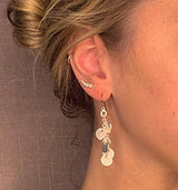 model wearing organic-shaped silver earrings