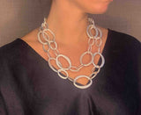 model wearing organic-shaped silver necklace