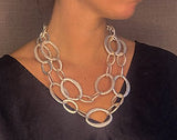 model wearing organic-shaped silver necklace