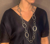 model wearing organic-shaped silver necklace