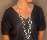 model wearing organic-shaped silver necklace