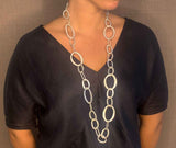 model wearing organic-shaped silver necklace
