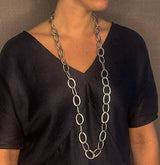 model wearing organic-shaped silver necklace