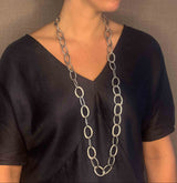 model wearing organic-shaped silver necklace