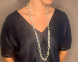 model wearing organic-shaped silver necklace