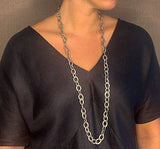 model wearing organic-shaped silver necklace