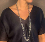 model wearing organic-shaped silver necklace