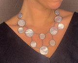 model wearing organic-shaped silver necklace