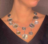 model wearing organic-shaped silver necklace