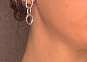 model wearing organic-shaped silver earrings