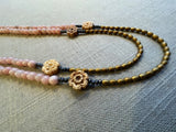 side view of gemstone bead necklace comprising antique hand-carved bone flowers, pink opal and gold hematite