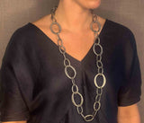 model wearing organic-shaped silver necklace
